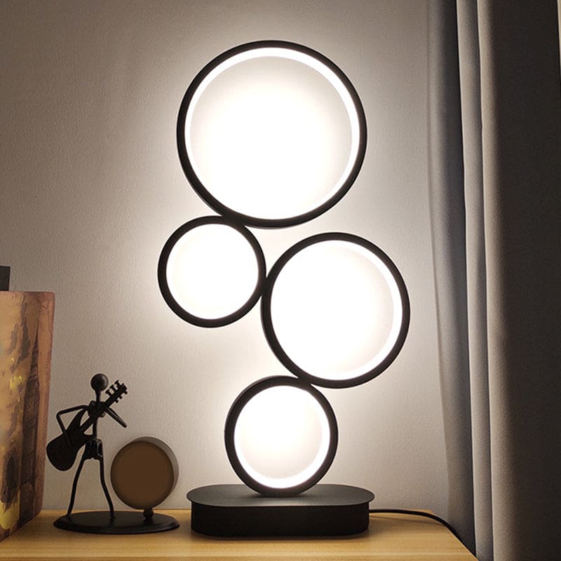 NinaLight - Lampada da tavolo semplice impilata con base circolare