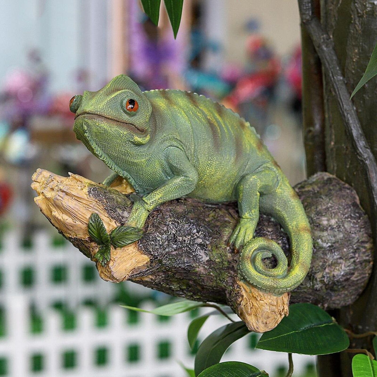 Resin chameleon figurine on the tree