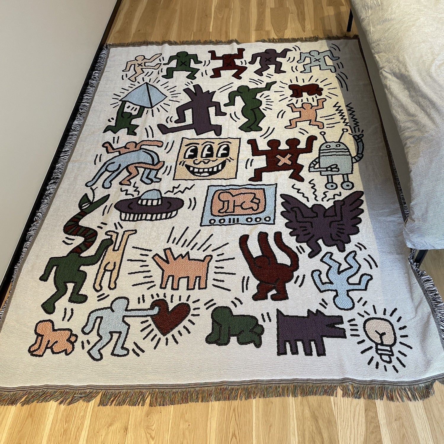 Coperta a forma di puzzle di Keith Haring