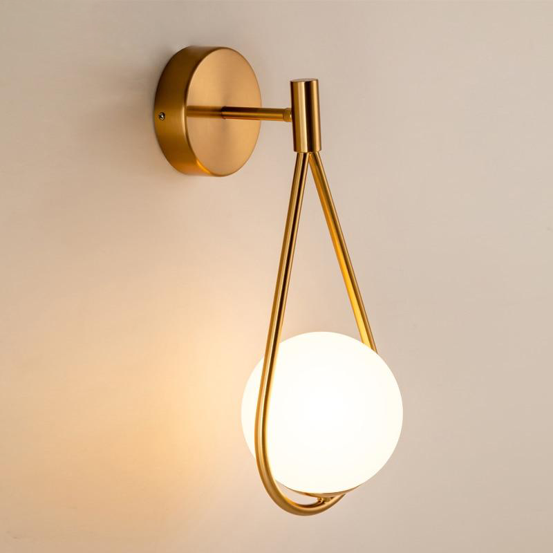 Loop Brass and Sphere Sconce