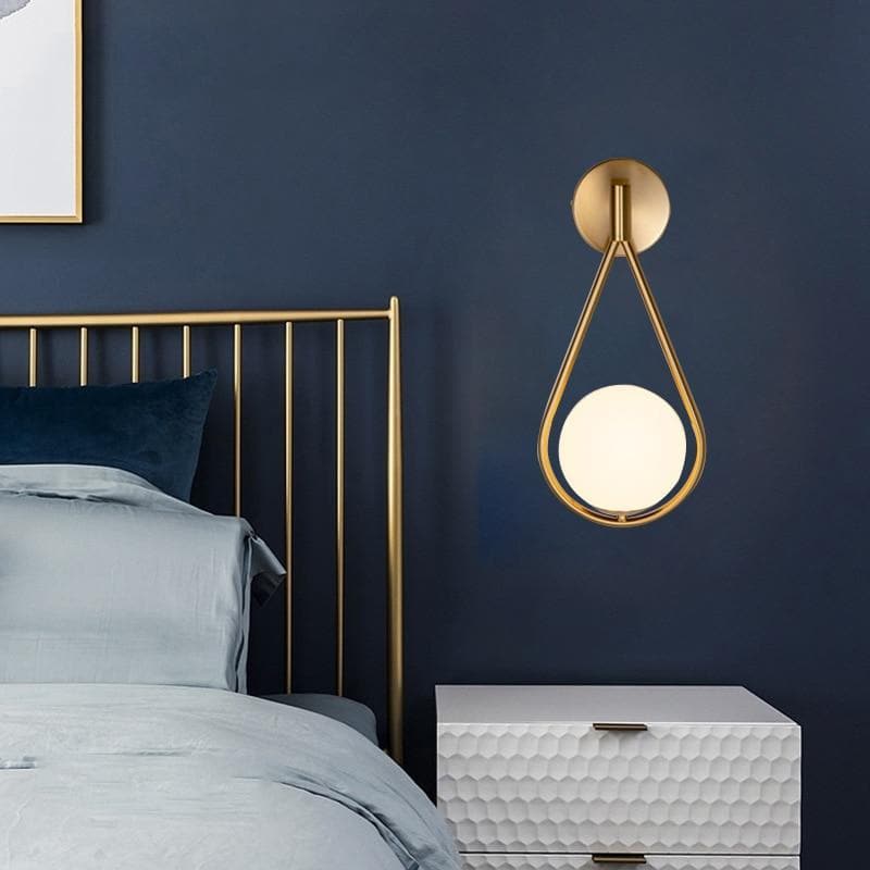 Loop Brass and Sphere Sconce