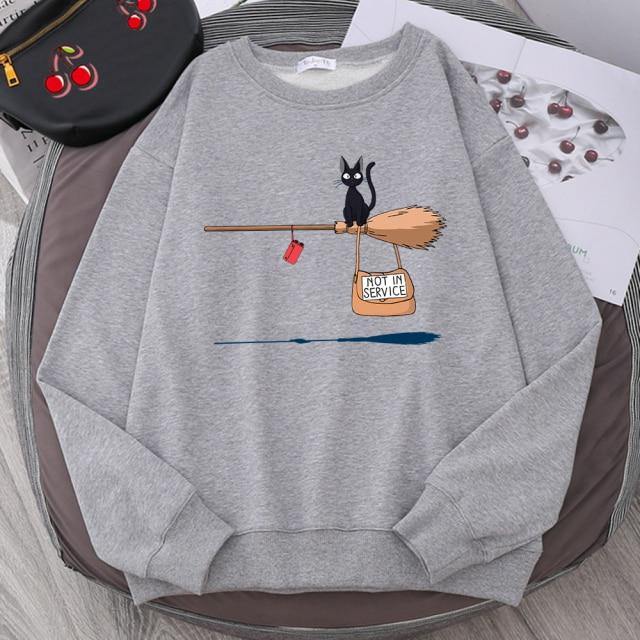 Sudadera con capucha y escoba de gato negro