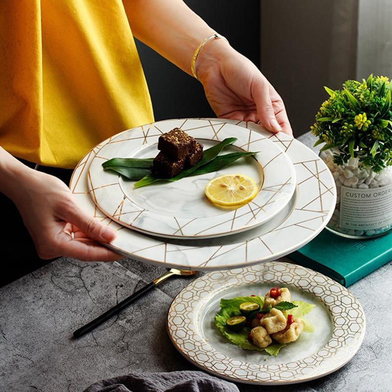 Ensemble d'assiettes en céramique et marbre à rayures dorées